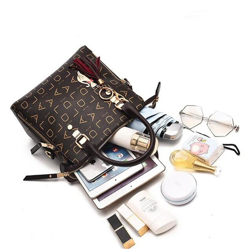 Sac à main en cuir PU avec lettres anglaises pour femmes, sac à poignée supérieure avec pompon, sac à bandoulière de luxe de grande capacité, fourre-tout Design