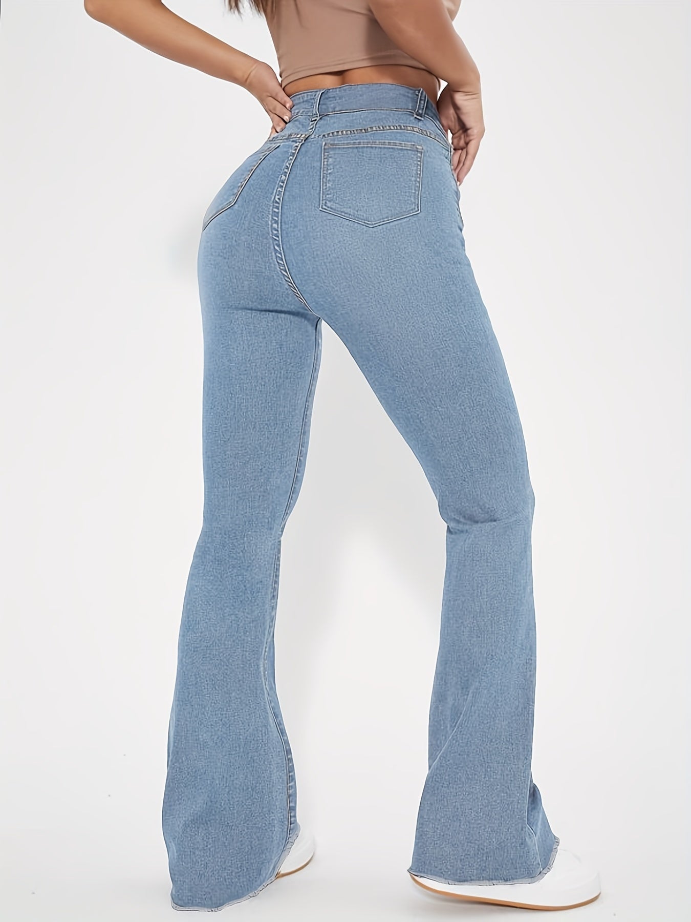 High-Rise Blue Raw Hem Flare Jeans - Slim Fit Bell Bottoms for Women - High-Stretch Denim Clothing with Trendy Style