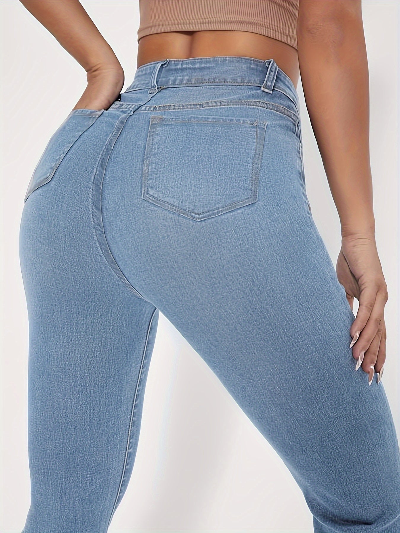 High-Rise Blue Raw Hem Flare Jeans - Slim Fit Bell Bottoms for Women - High-Stretch Denim Clothing with Trendy Style